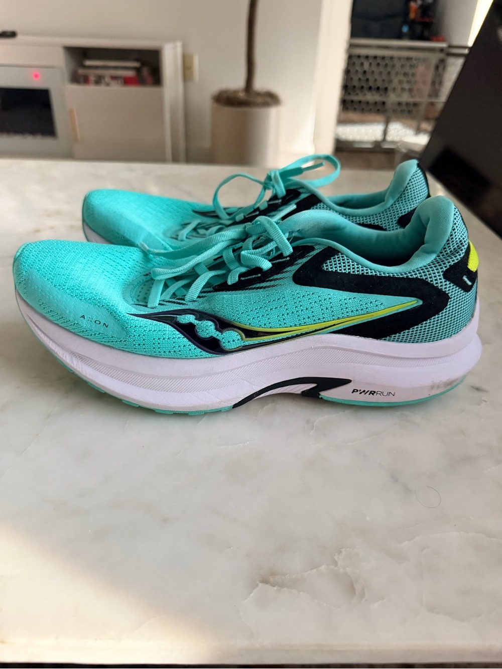 Saucony Women's Teal/Aqua Running Shoes with Black and Yellow Accents